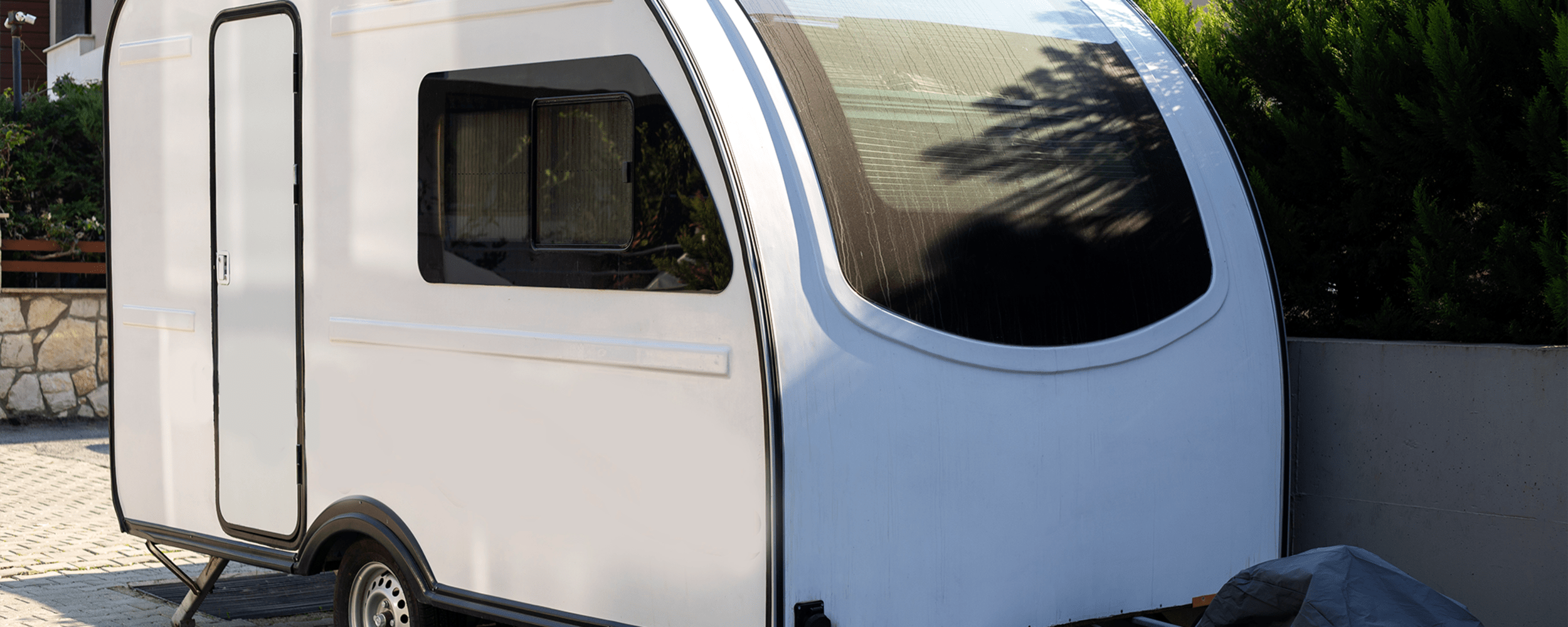 A small camping trailer parked at RoadRunner RV Storage, Roseville, California