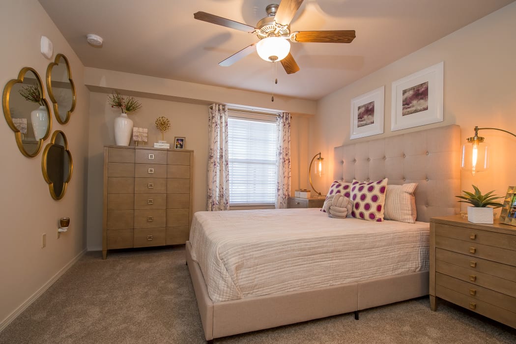 Well-lit bedroom at Portico at Friars Creek Apartments in Temple, Texas