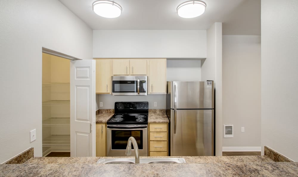 Modern kitchen in model home at Woodland Apartments in Olympia, WA