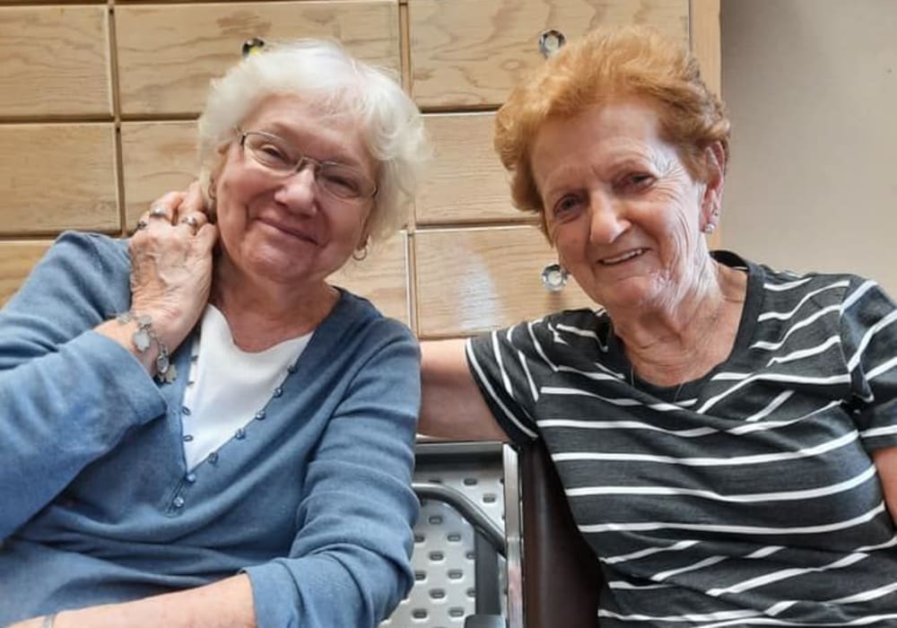 Two smiling residents at Bell Tower Residence Assisted Living in Merrill, Wisconsin