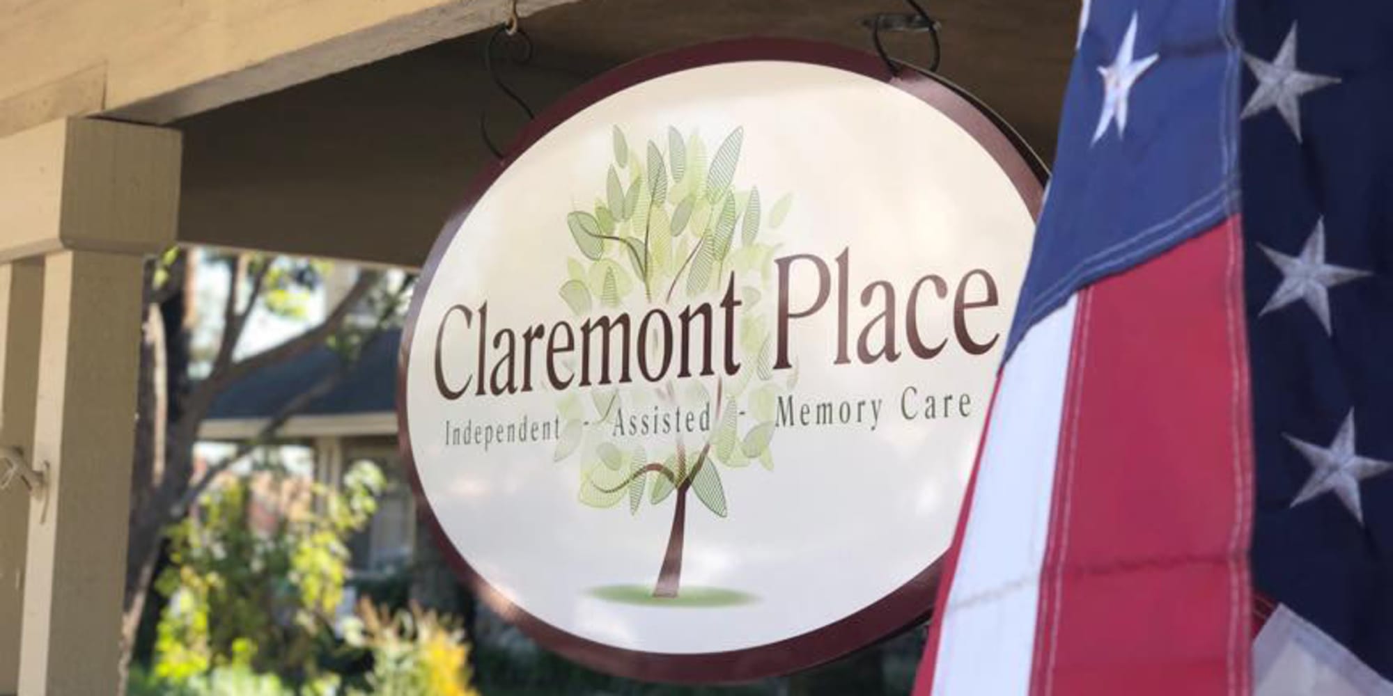 Claremont Place in Claremont, California, Exterior sign with American flag 