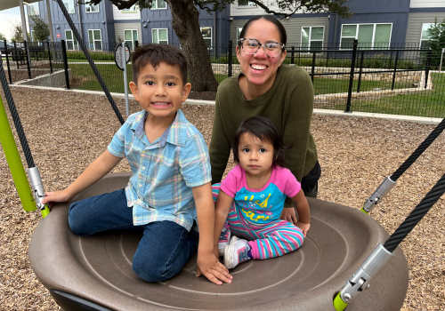 A happy resident family at Sierra Vista Apartments in Austin,Texas 