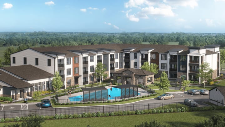 A computer-rendered aerial view of a 3-story apartment building with a clubhouse attached on the left side, featuring a swimming pool and covered patio area in front which is surrounded by perimeter fencing.