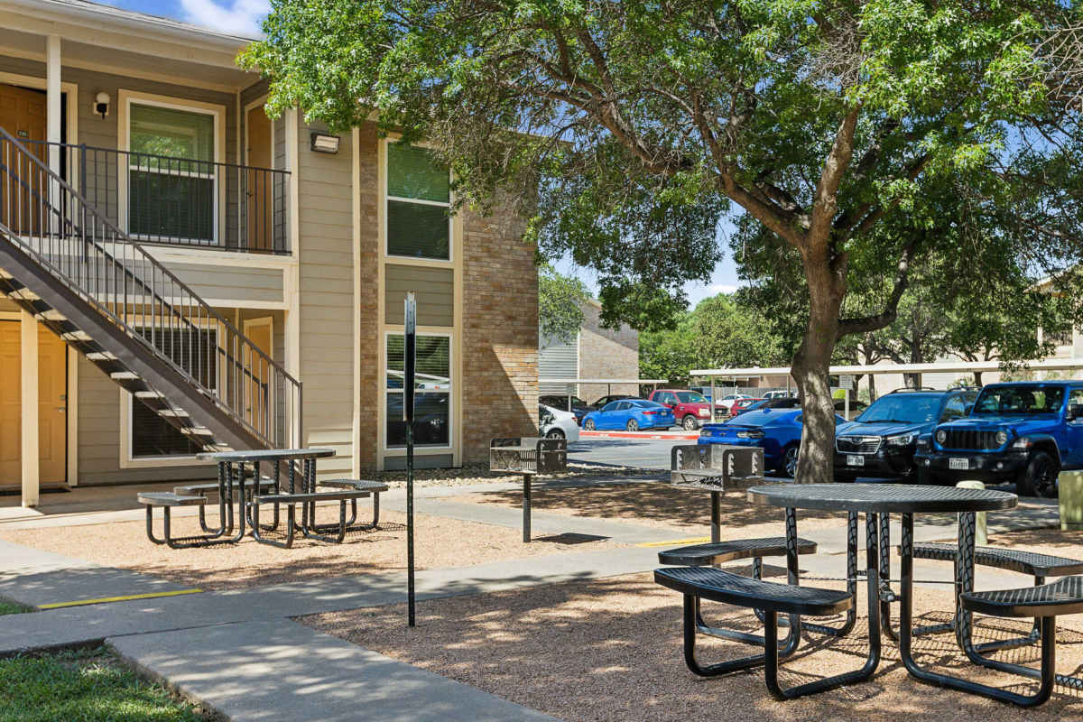 Picnic and grilling area with grill stations and seating at Creekside in San Angelo, Texas