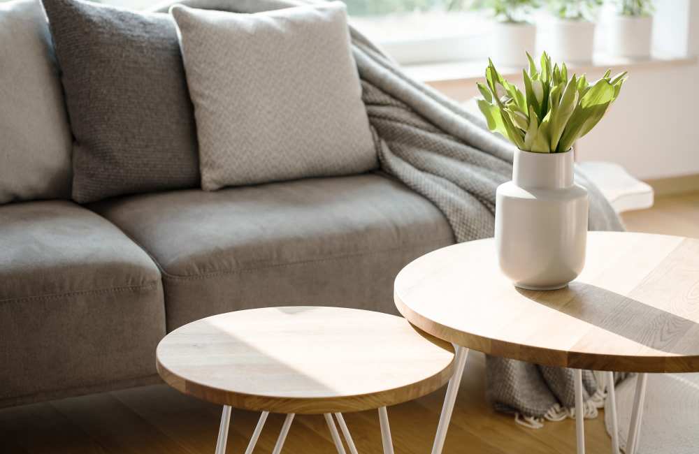 Living room with chair, coffee table and wall art at Stonebridge Crossing Apartment Homes in Cordova, Tennessee