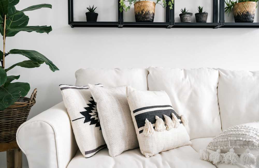 Cozy living room with a white sofa at Stonebridge Crossing Apartment Homes in Cordova, Tennessee