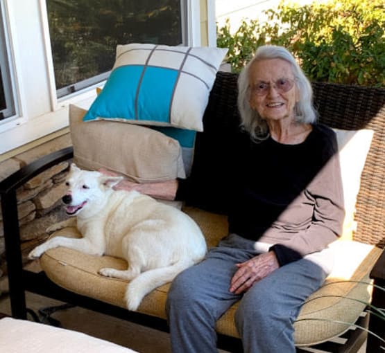 A resident and her dog at Amber Grove Place in Chico, California