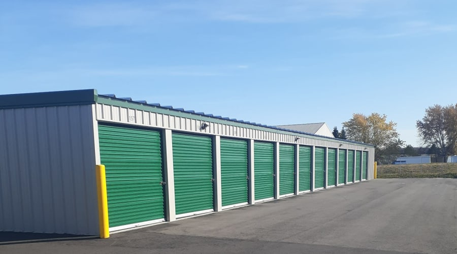 Storage units with green doors outside at KO Storage in Saint Cloud, Minnesota