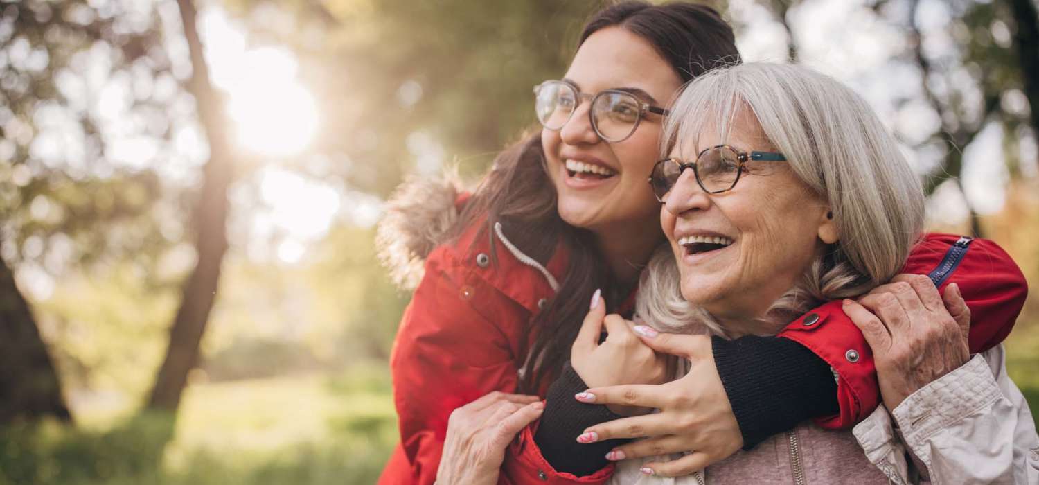 Senior resident and younger person enjoying quality time at Capital Towers in Raleigh, North Carolina
