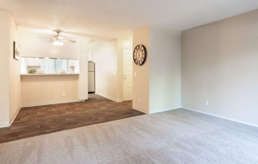 Unfurnished living room and dining area with kitchen view at Amber Court in Fremont, California