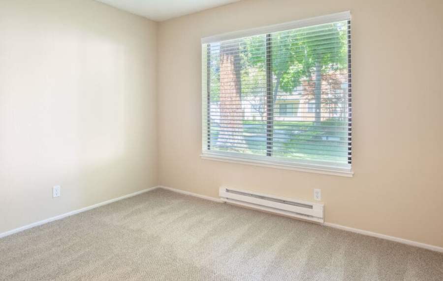Unfurnished bedroom with carpet flooring at Amber Court in Fremont, California