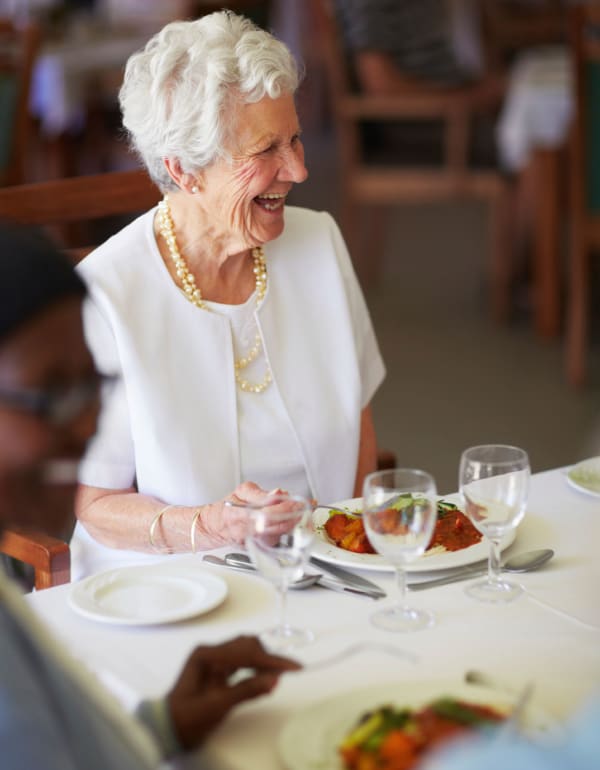 Resident eating dinner at The Phoenix at Greer in Greer, South Carolina