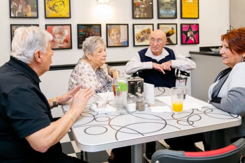 Residents enjoying beverages in the bisro/cafe at Crescent Fields at Huntingdon Valley in Huntingdon Valley, Pennsylvania