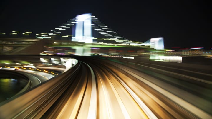 A point of view of a vehicle moving fast on a city street. 
