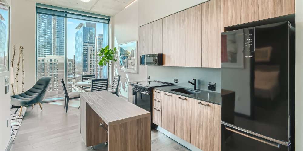Apartment kitchen with large windows and great views at Sienna At The Thompson in Austin, Texas