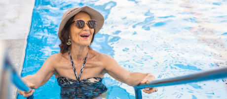 Resident walking out of a pool at Sky Vista in Mesa, Arizona