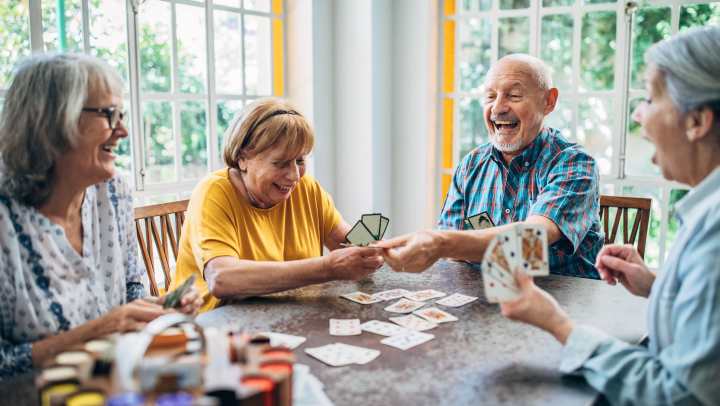 Residents happily playing cards