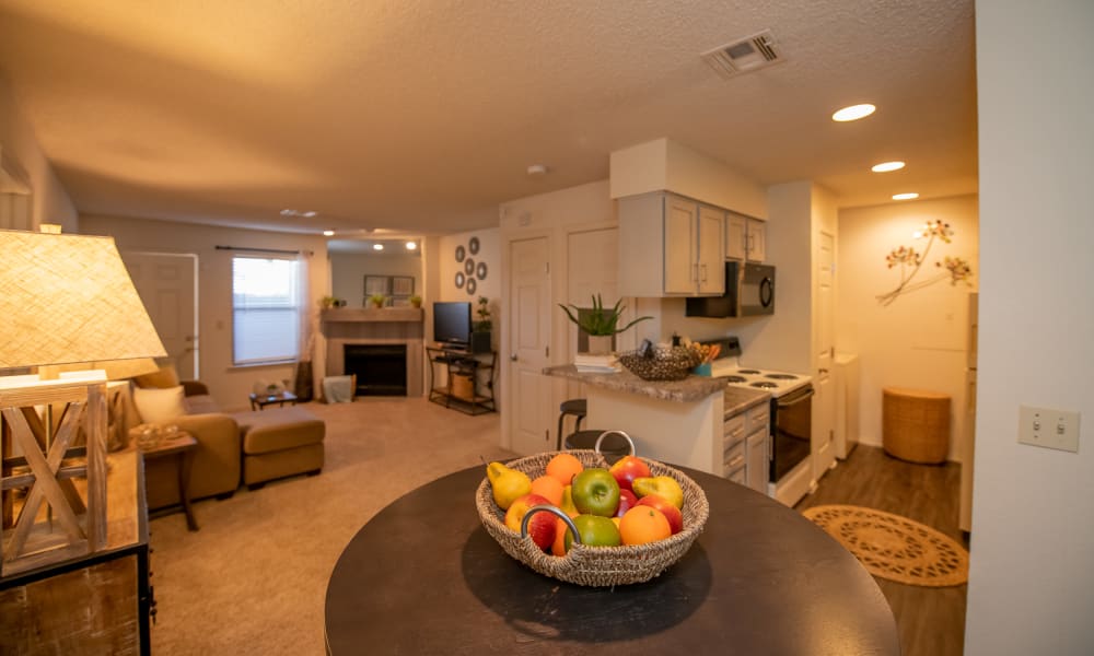Living room, dining room and kitchen at Polo Run Apartments in Tulsa, Oklahoma