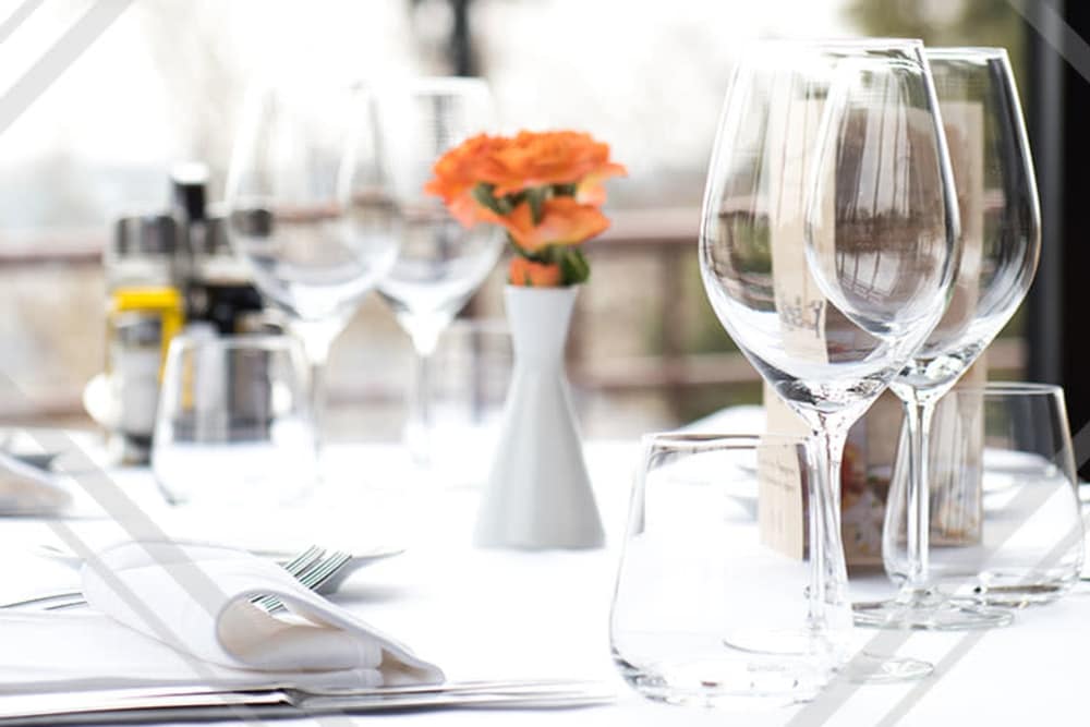 Well decorated dinner table with elegant cup glass at Pleasantview Townhomes in Baltimore, Maryland