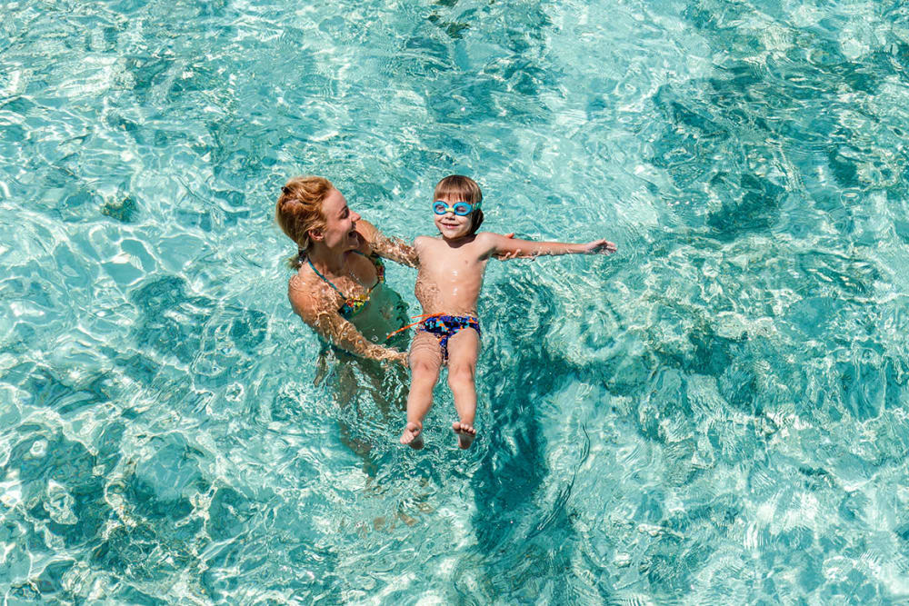 Family swimming in the pool at Vital at Springbrook in Alcoa, Tennessee