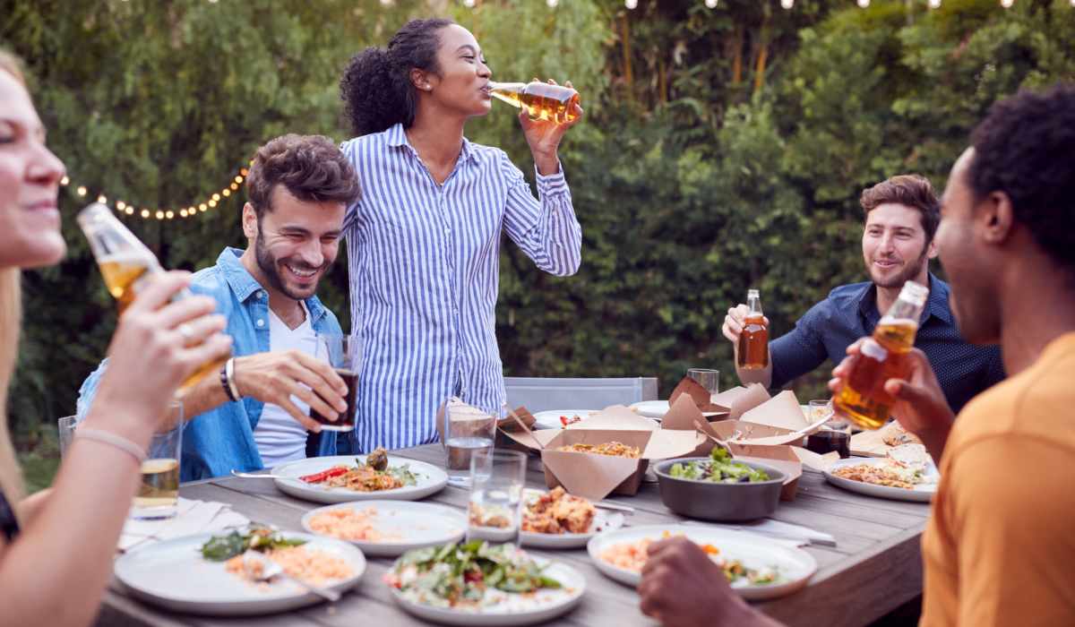 Residents sharing a meal outside at Casa Aliento in Oxnard, California