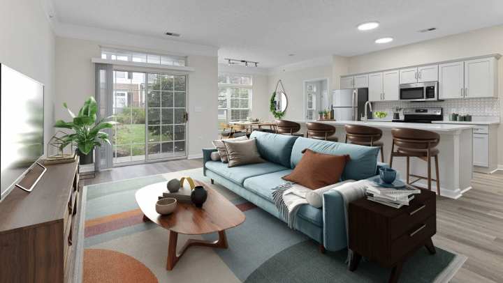 Vibrant living room with open kitchen with tv