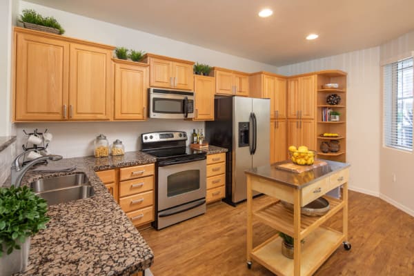 Kitchen with wooden cabinets at The Fleetwood in Tempe, Arizona