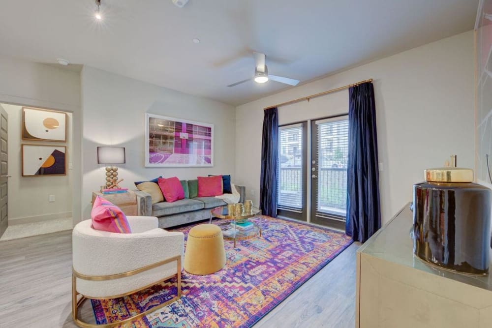 Modern furnishings in the living area of a model home at Palmetto Pointe in San Antonio, Texas