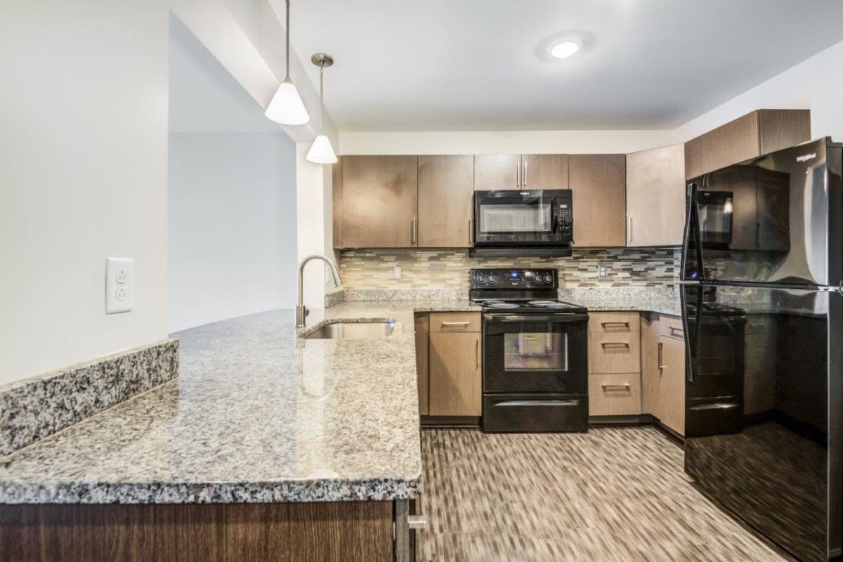 Kitchen and dining area at Greenwood Cove Apartments in Rochester, New York