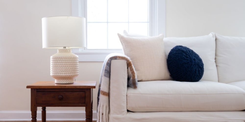 A couch and coffee table in an apartment at Vesta Creeks Run in North Charleston, South Carolina