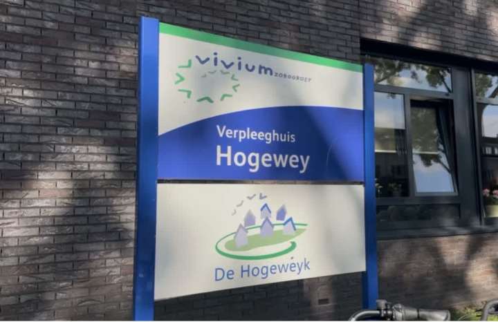 Entrance sign for De Hogeweyk dementia village in Weesp, Netherlands, showing the name Hogewey and Vivium Zorggroep, where Jill Zimmerman visited.