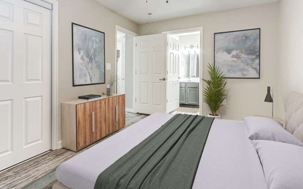Model bedroom with attached bathroom at Oak Place Apartments in Oklahoma City, Oklahoma