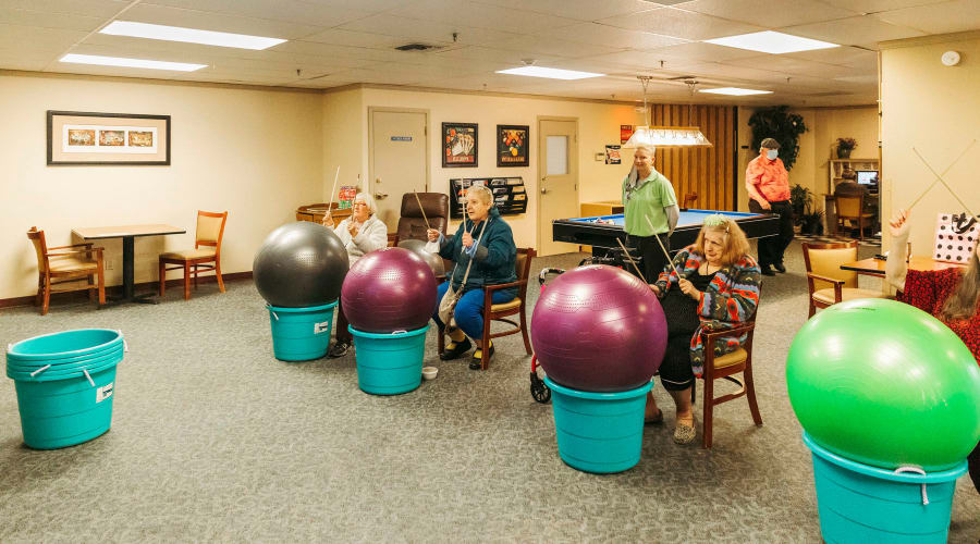 Residents in a drumming activity at Cascade Park Vista Assisted Living in Tacoma, Washington