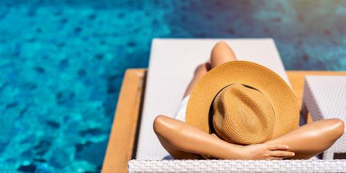 Resident relaxing by the pool at Hunters Run in Middleburg, Florida