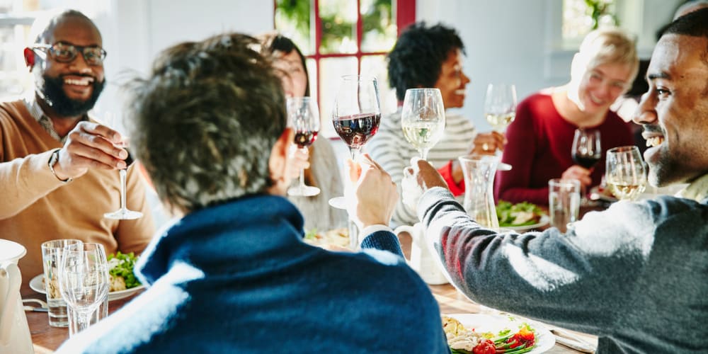 A group of friends enjoying a meal near Indigo Champions Ridge in Davenport, Florida