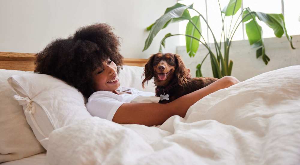 Resident with her dog in her pet friendly apartment at The Summit At Old Trail in Crozet, Virginia