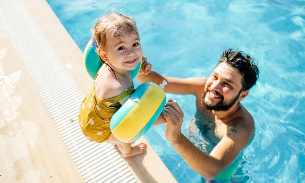 Father and son in a pool at Castleberry Property Management Group inc. in Birmingham, Alabama