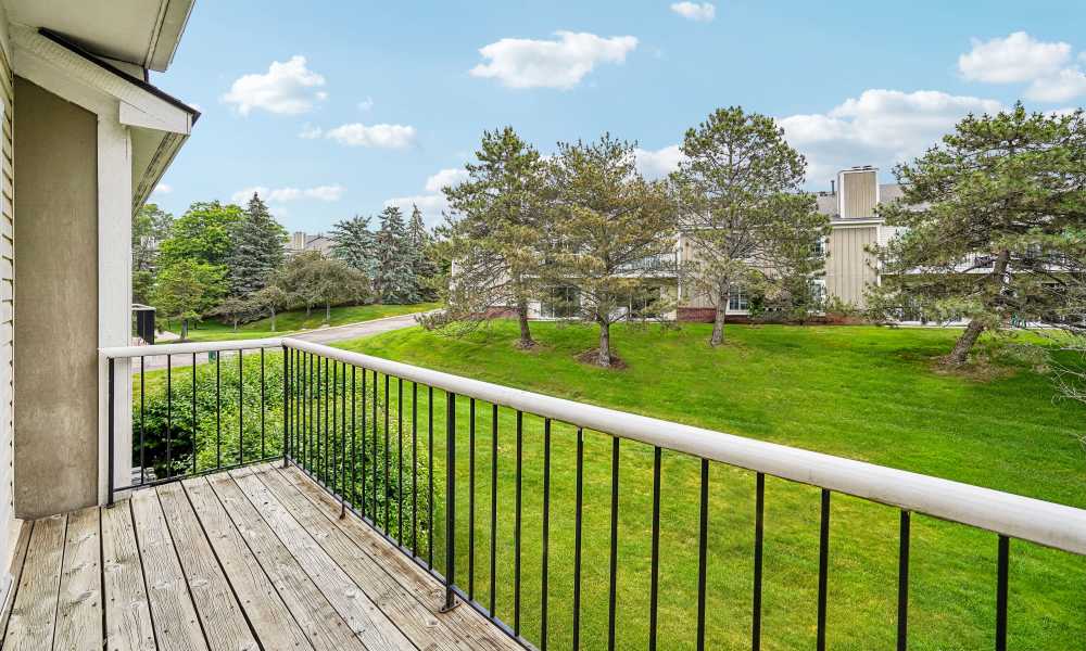 Balcony with railing view of landscaped grounds at Citation Club in Farmington Hills, Michigan