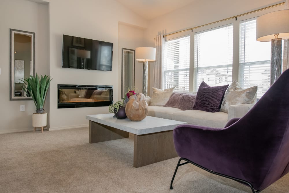 Vaulted ceiling and LED fireplace in living room at Cedar Ridge in Tulsa, Oklahoma