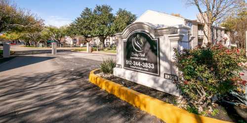 Entrance board of the community at Derby Park Apartments in Round Rock, Texas, 