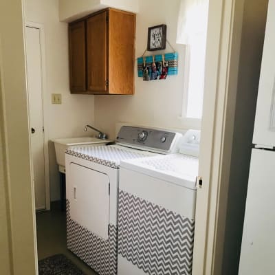 A laundry room with storage space at New Hillside in Joint Base Lewis McChord, Washington