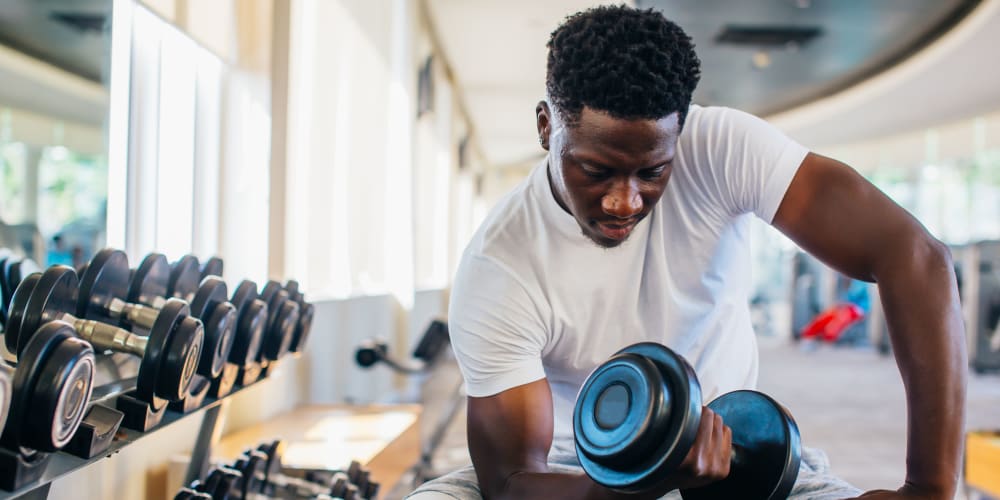 Resident using the fitness center at Artisan Crossing in Norman, Oklahoma