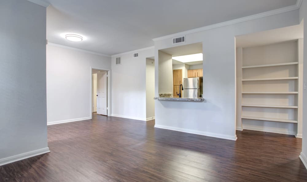 Hardwood floors in the open-concept layout of a model home at Riata Austin in Austin, Texas