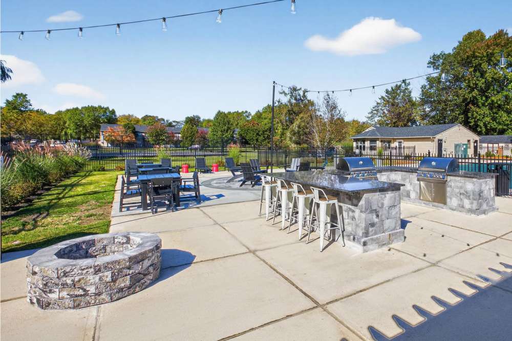 Grill area with fire pits at Eagle Rock Apartments at Mohegan Lake in Mohegan Lake, New York