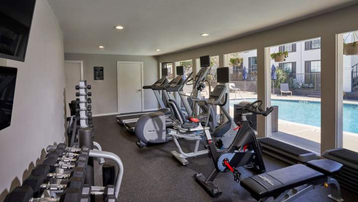  A fitness center with fully equipped materials and a pool.