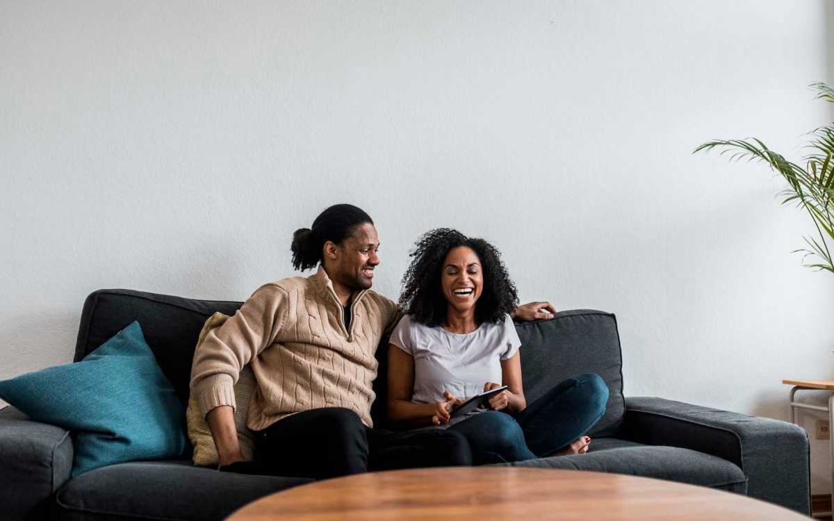 Resident couple in their living room at Maplewood Court in Bridgeport, Connecticut