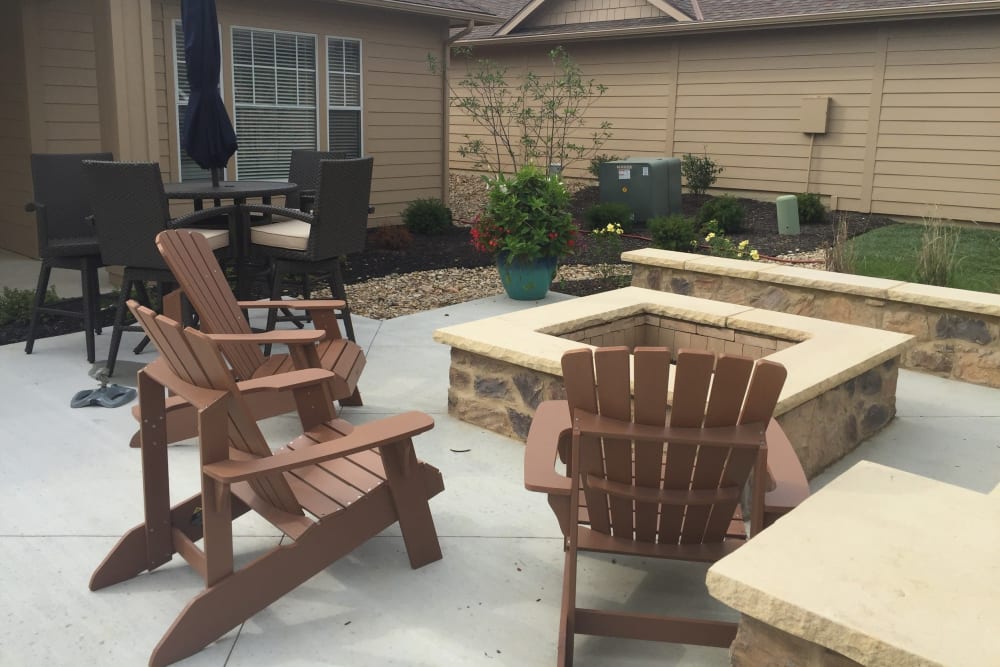Outdoor fireplace with seating at Alvadora Apartments in Lawrence, Kansas