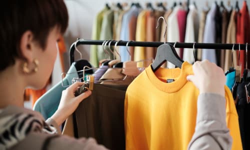 Resident looking at clothing on a rack in a shop near Palmetto Circle in North Augusta, South Carolina