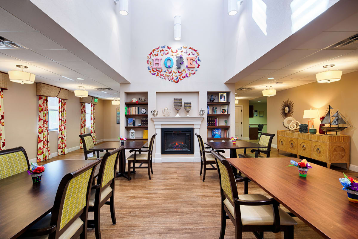 The interior lobby with a fireplace at The Fountains of Hope in Sarasota, Florida.