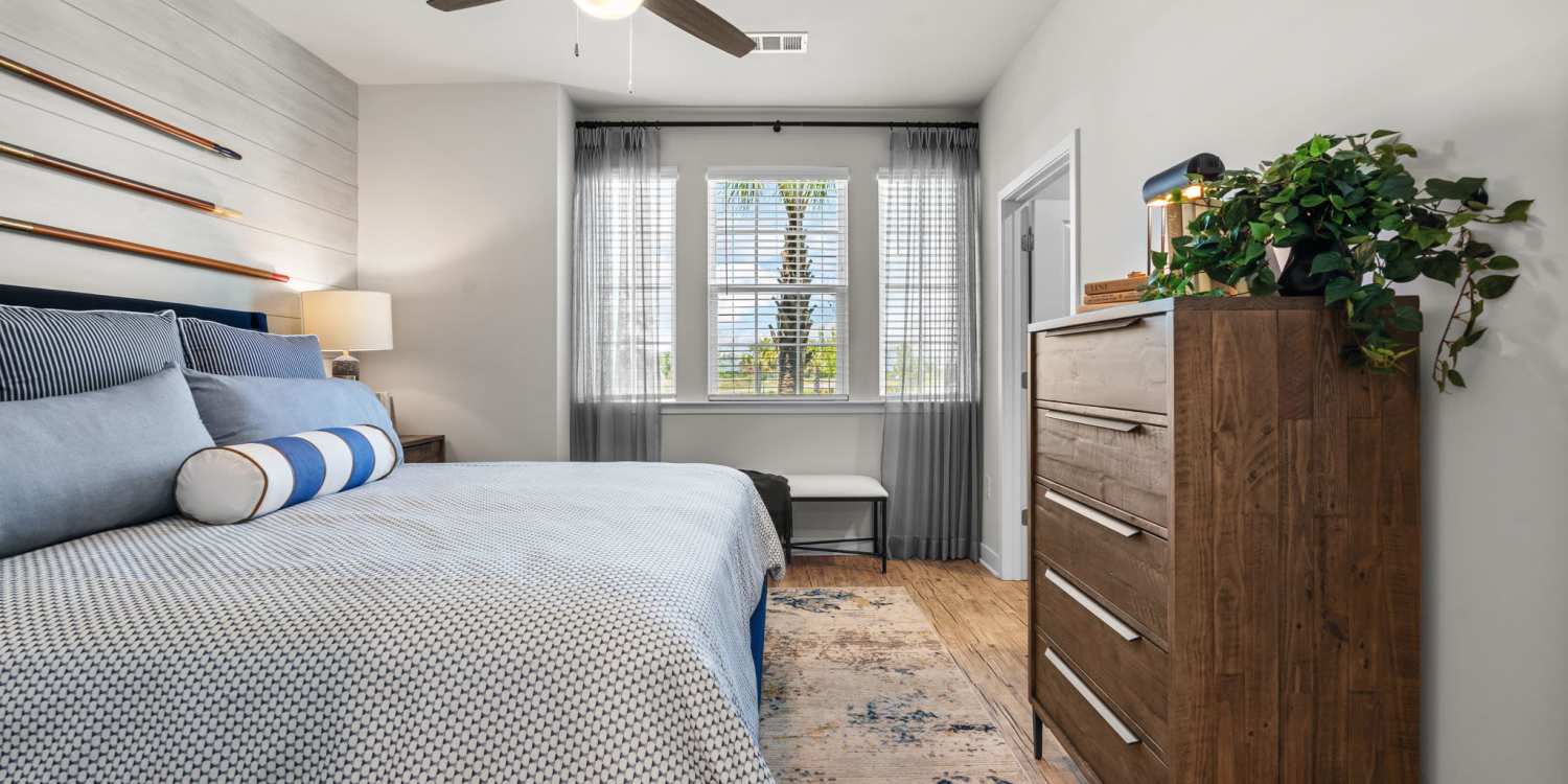 Bedroom with king size bed and dresser at Mexico Beach Crossings